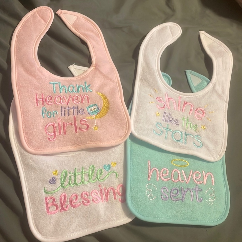 4 pack, baby girl bibs, never been used